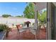 Charming brick patio with a glass-top table and chairs, perfect for outdoor dining and relaxation at 9915 Kona Isle Ct, Orlando, FL 32817