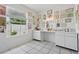 Bright room with white cabinets, white walls and tile floor, perfect for professional use or hobby space at 9915 Kona Isle Ct, Orlando, FL 32817