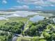 Aerial view of the home and property showing a lot that leads to a river at 1003 Shore Dr, Kissimmee, FL 34744