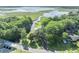 Aerial view showcasing the property's access to waterways, surrounded by lush greenery and a serene natural setting at 1003 Shore Dr, Kissimmee, FL 34744