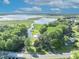 Gorgeous aerial view of the property with lush greenery and water at 1003 Shore Dr, Kissimmee, FL 34744
