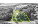 Monochrome aerial view showing home on a riverfront lot at 1003 Shore Dr, Kissimmee, FL 34744