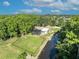 An aerial view of the backyard and patio with access to a canal at 1003 Shore Dr, Kissimmee, FL 34744