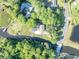 Overhead view of home with mature landscaping, private backyard and waterfront access at 1003 Shore Dr, Kissimmee, FL 34744