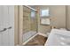 Bathroom with tile shower and sliding glass door at 1003 Shore Dr, Kissimmee, FL 34744