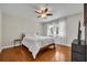 Sunny bedroom with hardwood floors and sheer white curtains at 1003 Shore Dr, Kissimmee, FL 34744