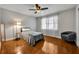Bright bedroom with wood flooring and large window at 1003 Shore Dr, Kissimmee, FL 34744