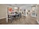Dining room with an open view to the kitchen and lovely decor at 1003 Shore Dr, Kissimmee, FL 34744