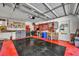 Large garage area with lots of shelving and tool storage at 1003 Shore Dr, Kissimmee, FL 34744