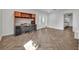 Spacious home office with desk and chair with adjacent view of the front door and a bedroom at 1003 Shore Dr, Kissimmee, FL 34744