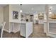 Open kitchen with an island, stainless appliances, and lots of counter space at 1003 Shore Dr, Kissimmee, FL 34744
