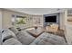 Comfortable living room with backyard views, fireplace, and stylish furnishings at 1003 Shore Dr, Kissimmee, FL 34744