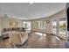 Bright living room with access to outdoor pool area and lush landscaping at 1003 Shore Dr, Kissimmee, FL 34744
