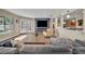 Cozy living room with French doors, electric fireplace, and stylish furnishings at 1003 Shore Dr, Kissimmee, FL 34744