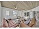 Relaxing sunroom with view of pool, tile floors, and wood ceiling at 1003 Shore Dr, Kissimmee, FL 34744