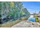Waterfront with trees and foliage; access to waterway and lake at 1003 Shore Dr, Kissimmee, FL 34744