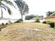Spacious backyard featuring a white privacy fence and established landscaping at 10235 Summer Elm Ave, Clermont, FL 34711