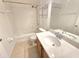 Bathroom featuring a shower-tub combo and vanity sink at 10235 Summer Elm Ave, Clermont, FL 34711