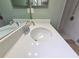 Bathroom featuring a sink with a mirror, countertop, and a walk-in shower in the background at 10235 Summer Elm Ave, Clermont, FL 34711