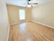 Bedroom with natural lighting and spacious wood floors at 10235 Summer Elm Ave, Clermont, FL 34711