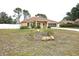 Well-maintained single-Gathering home with neutral exterior, screened garage, and front yard at 10235 Summer Elm Ave, Clermont, FL 34711