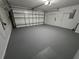 Spacious garage with painted floor at 10235 Summer Elm Ave, Clermont, FL 34711