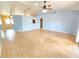 Bright living room with wood floors and high ceiling at 10235 Summer Elm Ave, Clermont, FL 34711