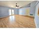 Inviting living room with vaulted ceilings, wood-look floors, and natural light at 10235 Summer Elm Ave, Clermont, FL 34711