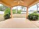 Covered patio overlooking the private backyard at 10235 Summer Elm Ave, Clermont, FL 34711