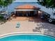 Overhead view of community pool and pool house on the lake with boat docks at 1156 Calle Del Norte # C, Casselberry, FL 32707