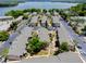 Aerial view of condo complex featuring well-maintained landscaping and ample parking at 1156 Calle Del Norte # C, Casselberry, FL 32707