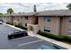 Exterior view of a two-story condo with beige stucco siding and parking at 1156 Calle Del Norte # C, Casselberry, FL 32707