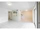 Open-concept living area with tile flooring and a pass-through to the kitchen at 1156 Calle Del Norte # C, Casselberry, FL 32707