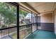 View from the screened in patio of green courtyard with mature trees and landscaping at 1156 Calle Del Norte # C, Casselberry, FL 32707