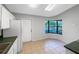 An eat-in kitchen features bright natural light, tile floor and green countertops at 12610 Bay Hill Dr, Grand Island, FL 32735
