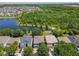 Spacious community with a scenic lake, lush greenery, and well-maintained homes at 12822 Moss Park Ridge Dr, Orlando, FL 32832