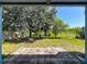 View from the patio showcases a spacious backyard, creating an inviting outdoor living space at 12822 Moss Park Ridge Dr, Orlando, FL 32832