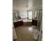 Bathroom with dual vanities, large soaking tub, and tiled floors at 12822 Moss Park Ridge Dr, Orlando, FL 32832