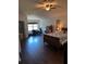 Main bedroom featuring wood floors, and a large window at 12822 Moss Park Ridge Dr, Orlando, FL 32832