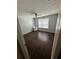 Bedroom featuring hardwood floors, a ceiling fan, and a window at 12822 Moss Park Ridge Dr, Orlando, FL 32832