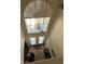 View of the entryway with a front door, tile floors, and a light fixture at 12822 Moss Park Ridge Dr, Orlando, FL 32832