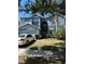 Charming two-story home with an attached garage and well-maintained front lawn and mature landscaping at 12822 Moss Park Ridge Dr, Orlando, FL 32832