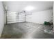 Spacious garage with an automatic door opener offering ample space for parking and storage solutions at 12822 Moss Park Ridge Dr, Orlando, FL 32832