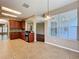 Bright kitchen with a view of the backyard through a large window at 12822 Moss Park Ridge Dr, Orlando, FL 32832
