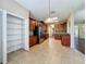 Spacious kitchen featuring tile flooring, cherry cabinets, and a pantry at 12822 Moss Park Ridge Dr, Orlando, FL 32832