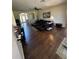 Spacious living room featuring an open floor plan and ample seating that's ideal for entertaining guests at 12822 Moss Park Ridge Dr, Orlando, FL 32832