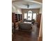 Comfortable living room with large windows for natural light and a cozy seating area with built-in shelving at 12822 Moss Park Ridge Dr, Orlando, FL 32832