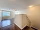 Upstairs room featuring hardwood flooring, natural light, and ceiling fan at 12822 Moss Park Ridge Dr, Orlando, FL 32832