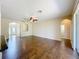 Open-concept living room with hardwood floors and recessed lighting at 12822 Moss Park Ridge Dr, Orlando, FL 32832