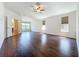 Large main bedroom with hardwood floors, en-suite bathroom, and bright windows at 12822 Moss Park Ridge Dr, Orlando, FL 32832